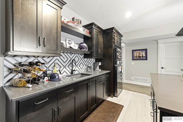 11412 S 122nd St, Papillion, NE 68046 - kitchen featuring a sink, open shelves, backsplash, recessed lighting, and light countertops