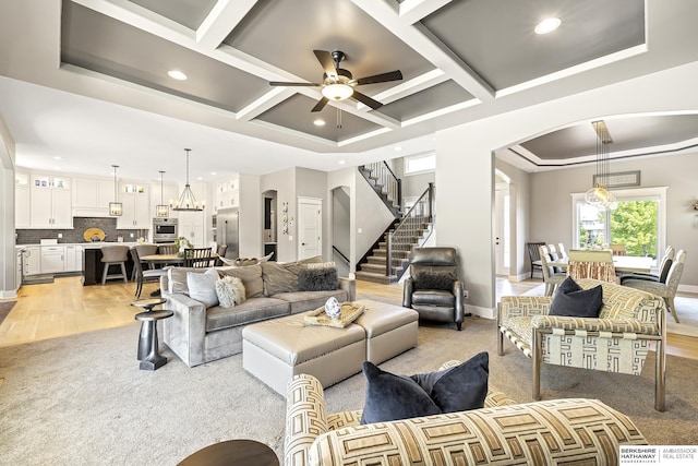 11412 S 122nd St, Papillion, NE 68046 - living room featuring arched walkways, coffered ceiling, light colored carpet, recessed lighting, and a ceiling fan