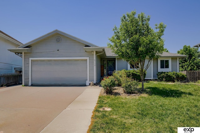 ranch-style house with concrete driveway and an attached garage