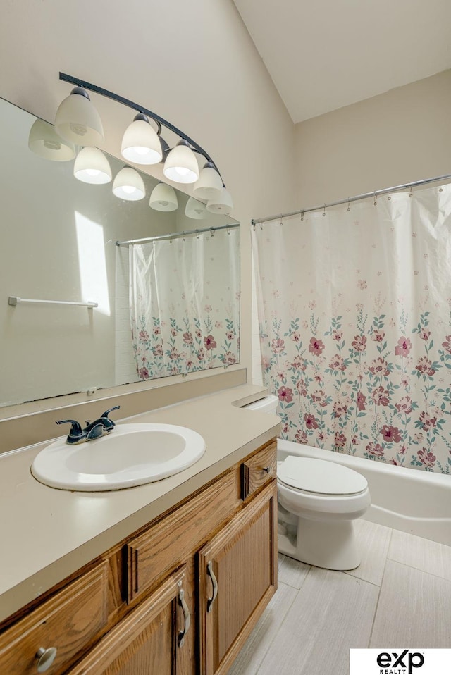 full bathroom with vanity, toilet, and shower / bath combo