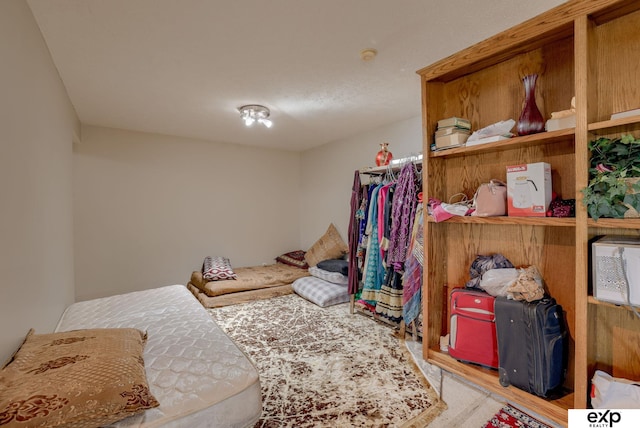 bedroom with wood finished floors