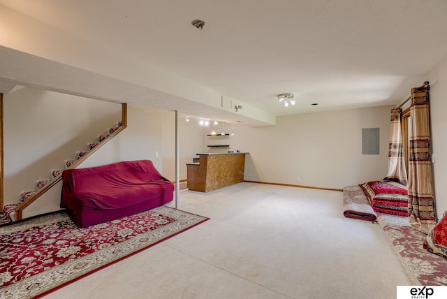 living area with carpet floors, electric panel, bar area, and baseboards