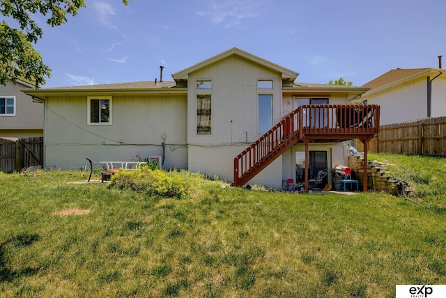 back of house featuring stairs and a wooden deck