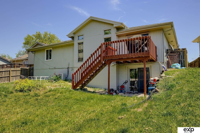 back of house with stairs and a wooden deck