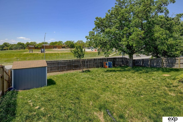 view of yard with a shed and an outbuilding