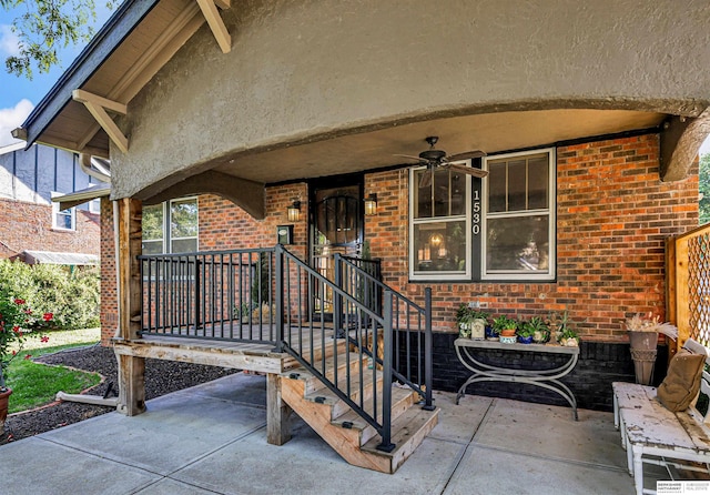 1530 S 52nd St, Omaha, NE 68106 - view of exterior entry with brick siding, a ceiling fan, and a patio area