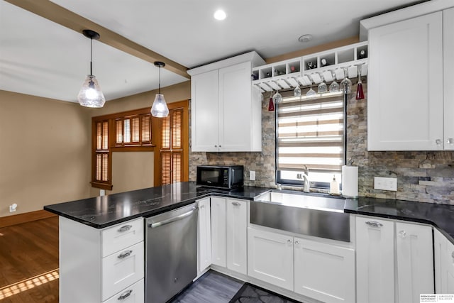 1530 S 52nd St, Omaha, NE 68106 - kitchen featuring stainless steel dishwasher, a peninsula, healthy amount of natural light, black microwave, and recessed lighting