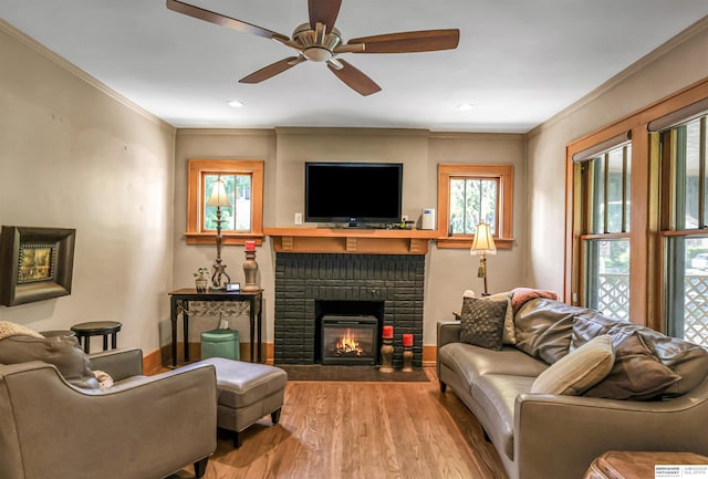 1530 S 52nd St, Omaha, NE 68106 - living area with ornamental molding, a brick fireplace, ceiling fan, wood finished floors, and recessed lighting