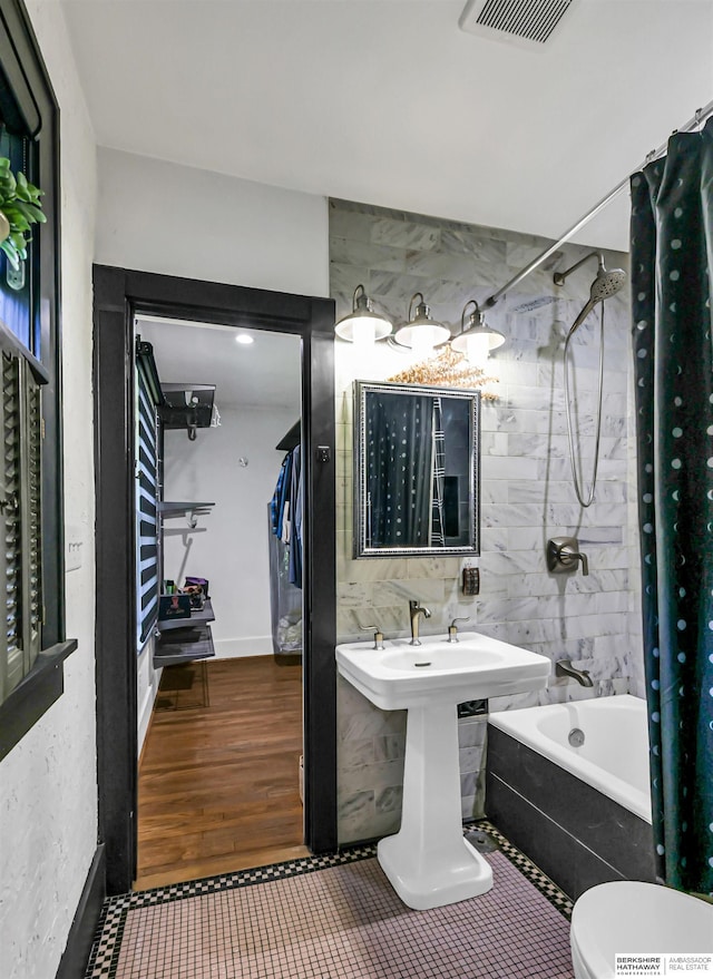 1530 S 52nd St, Omaha, NE 68106 - bathroom with shower / bath combo with shower curtain and tile walls