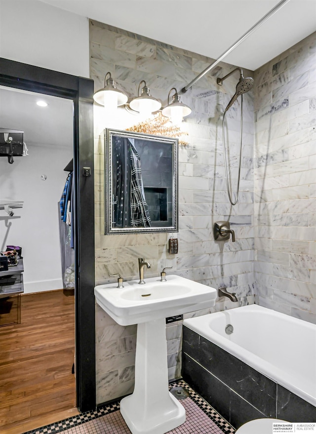 1530 S 52nd St, Omaha, NE 68106 - bathroom featuring tiled shower / bath combo and tile walls