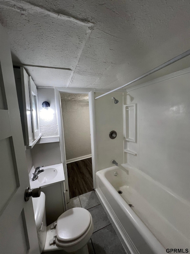 3941 X St, Omaha, NE 68107 - full bathroom featuring toilet, washtub / shower combination, vanity, tile patterned floors, and a textured ceiling