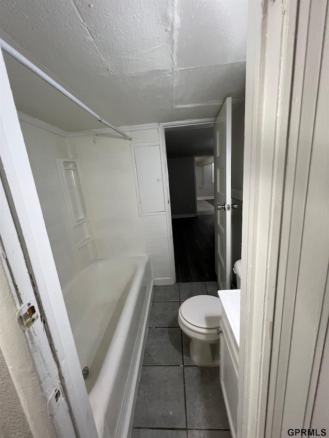 3941 X St, Omaha, NE 68107 - full bathroom with tile patterned floors, toilet, vanity, and a textured ceiling