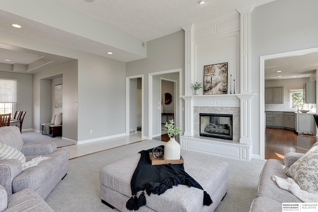 9901 S 176th St, Omaha, NE 68136 - living area featuring a high end fireplace, recessed lighting, carpet floors, and baseboards