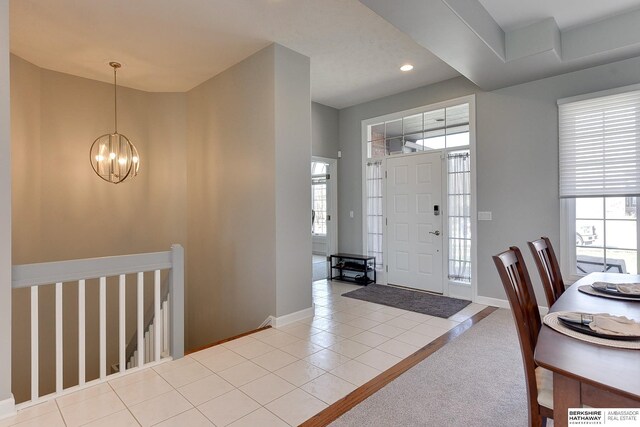 9901 S 176th St, Omaha, NE 68136 - tiled foyer featuring a chandelier, healthy amount of natural light, baseboards, and recessed lighting