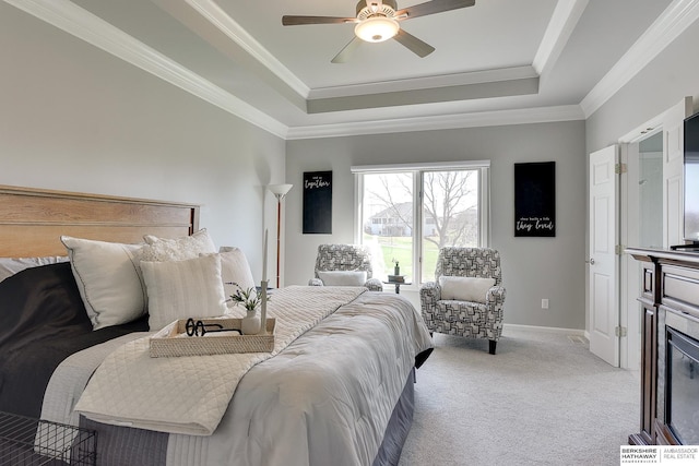 9901 S 176th St, Omaha, NE 68136 - carpeted bedroom featuring a raised ceiling, crown molding, baseboards, and a ceiling fan