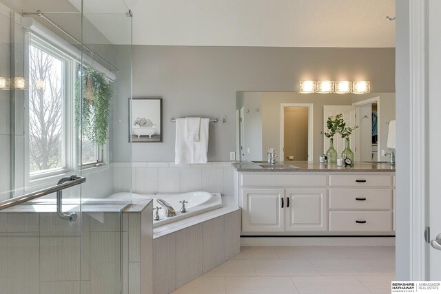 9901 S 176th St, Omaha, NE 68136 - bathroom with plenty of natural light, a bath, vanity, and tile patterned floors