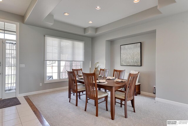 9901 S 176th St, Omaha, NE 68136 - dining space with a raised ceiling, baseboards, recessed lighting, light tile patterned floors, and light colored carpet