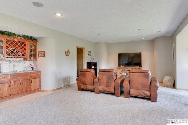 9901 S 176th St, Omaha, NE 68136 - living room with wet bar, light carpet, recessed lighting, and baseboards
