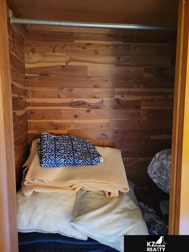 sauna / steam room with wooden walls