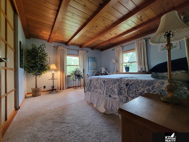 bedroom featuring carpet flooring, wood ceiling, and baseboards