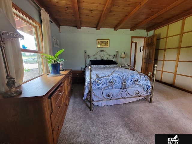 carpeted bedroom with beam ceiling and wooden ceiling