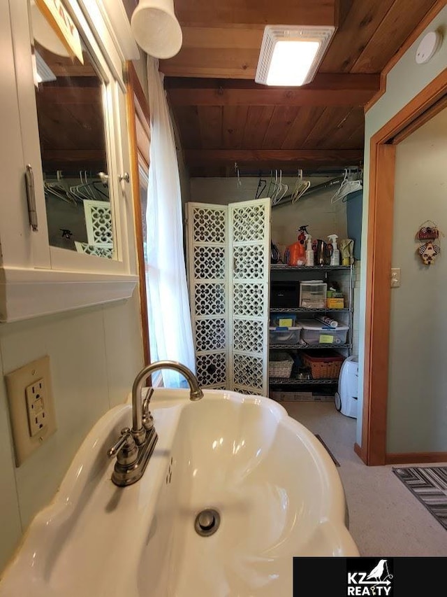 bathroom with wooden ceiling