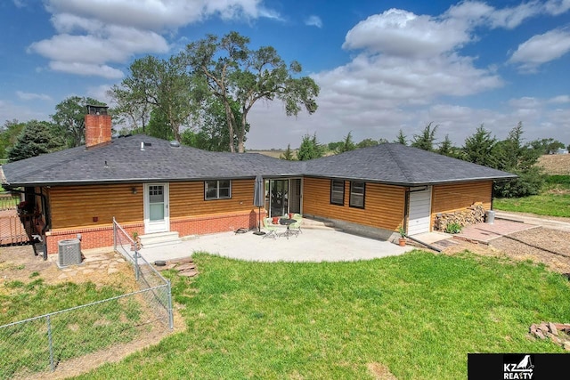 back of house with a chimney, central AC unit, entry steps, and a patio area