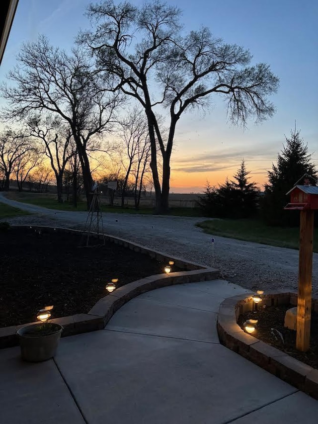 view of patio terrace at dusk