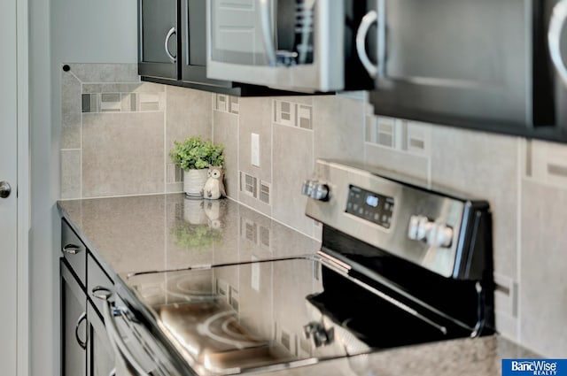 7308 Andy Dr, Lincoln, NE 68516 - kitchen featuring stainless steel appliances and tasteful backsplash