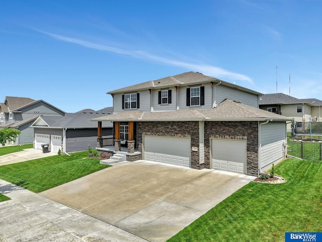 7308 Andy Dr, Lincoln, NE 68516 - view of front of house with a shingled roof, driveway, stone siding, and an attached garage
