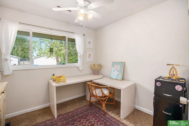 home office featuring carpet floors, baseboards, and a ceiling fan