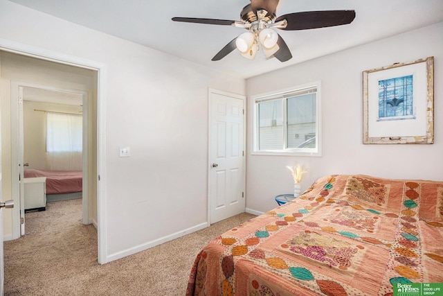 bedroom featuring light carpet, baseboards, and a ceiling fan