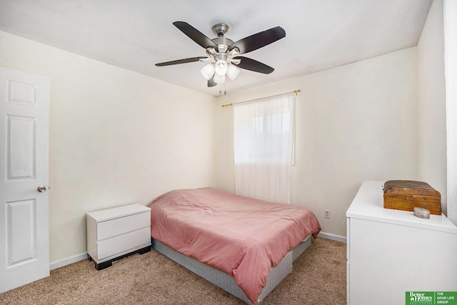 bedroom with light colored carpet, baseboards, and ceiling fan
