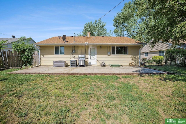 back of house with a patio