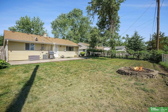 view of yard featuring a fire pit, a patio area, and cooling unit