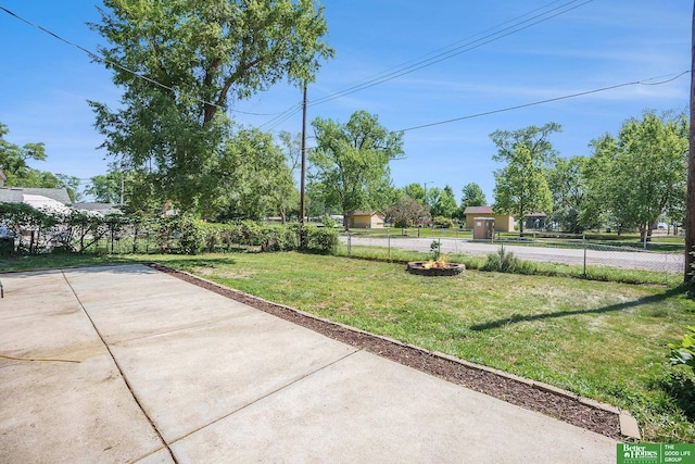 view of yard with a patio and a fire pit
