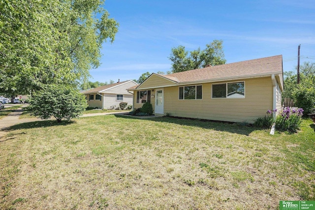 single story home featuring a front yard