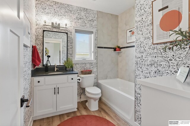 4803 N 192nd Ave, Elkhorn, NE 68022 - full bath featuring wood finished floors, toilet, and vanity