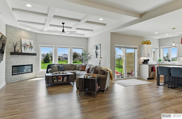 4803 N 192nd Ave, Elkhorn, NE 68022 - living room featuring healthy amount of natural light, a ceiling fan, beamed ceiling, wood-type flooring, and recessed lighting