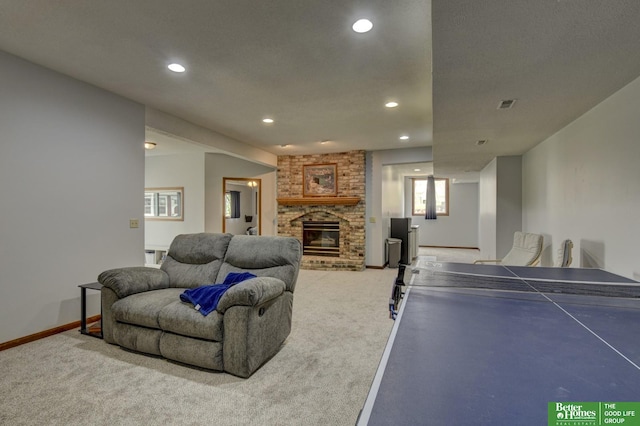 10032 Kings Dr, Omaha, NE 68142 - rec room featuring light carpet, recessed lighting, a brick fireplace, and baseboards