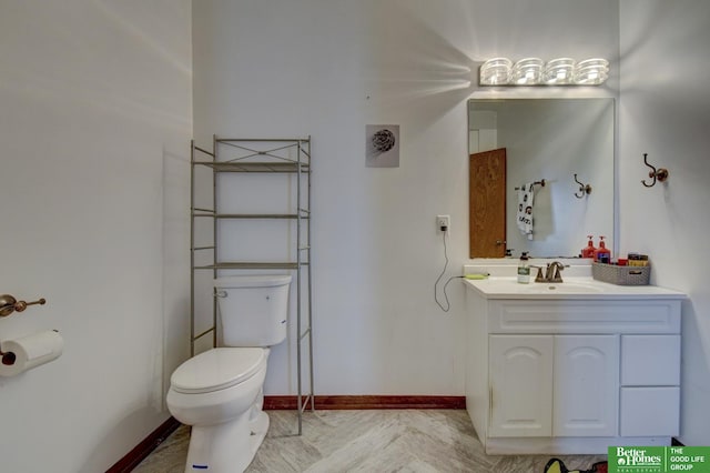 10032 Kings Dr, Omaha, NE 68142 - bathroom featuring toilet, vanity, and baseboards