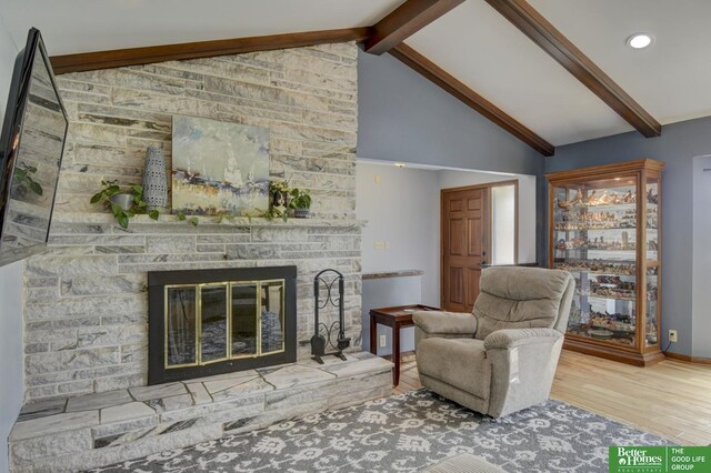 10032 Kings Dr, Omaha, NE 68142 - living room featuring wood finished floors, a fireplace, recessed lighting, and baseboards