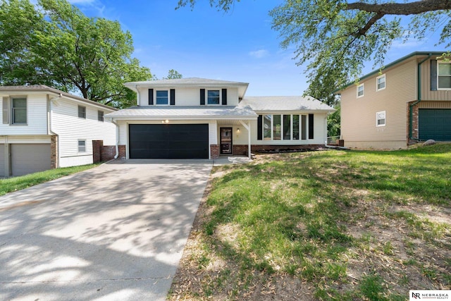14611 Holmes St, Omaha, NE 68137 - tri-level home with driveway, brick siding, an attached garage, and a front lawn