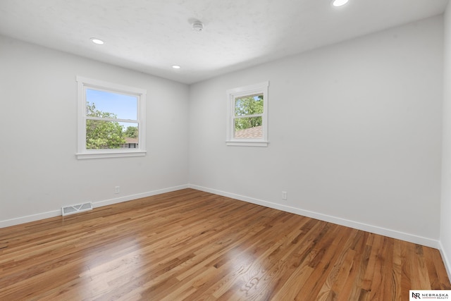 14611 Holmes St, Omaha, NE 68137 - spare room with baseboards, recessed lighting, light wood-style flooring, and a smoke detector