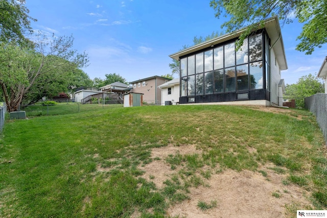 14611 Holmes St, Omaha, NE 68137 - rear view of property featuring a shed, an outbuilding, and a sunroom