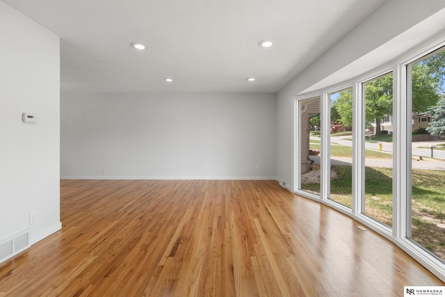 14611 Holmes St, Omaha, NE 68137 - spare room featuring recessed lighting, light wood finished floors, and baseboards