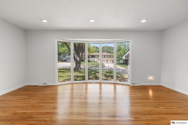 14611 Holmes St, Omaha, NE 68137 - spare room with plenty of natural light, light wood-style flooring, baseboards, and recessed lighting