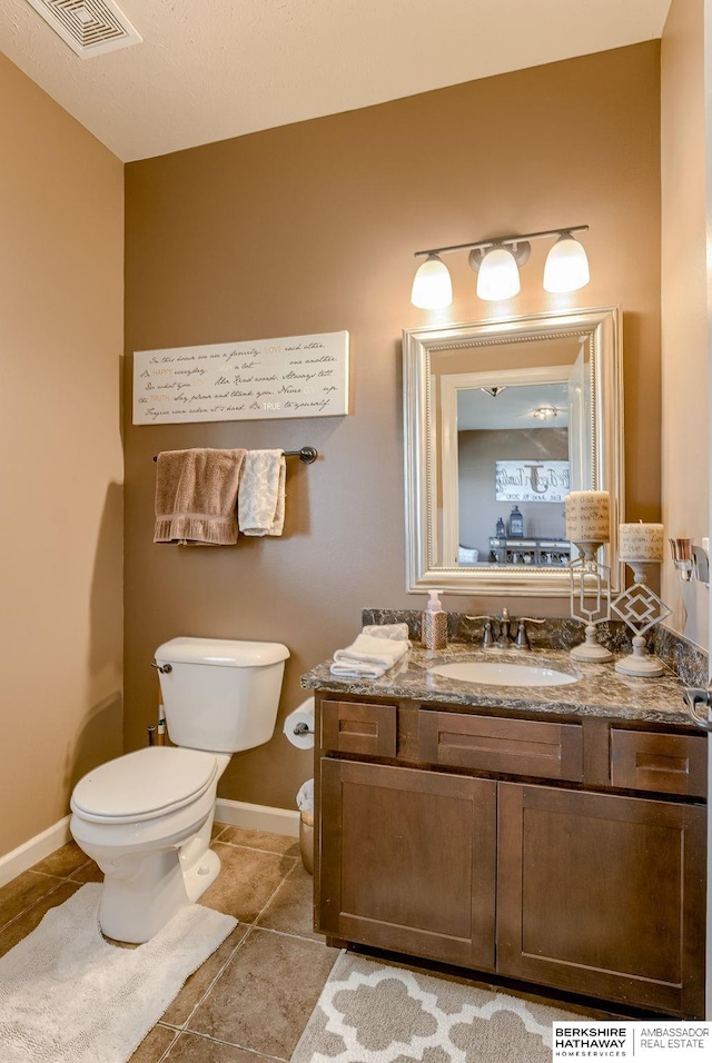 8902 N 161st Ave, Bennington, NE 68007 - half bath featuring toilet, vanity, baseboards, and tile patterned floors