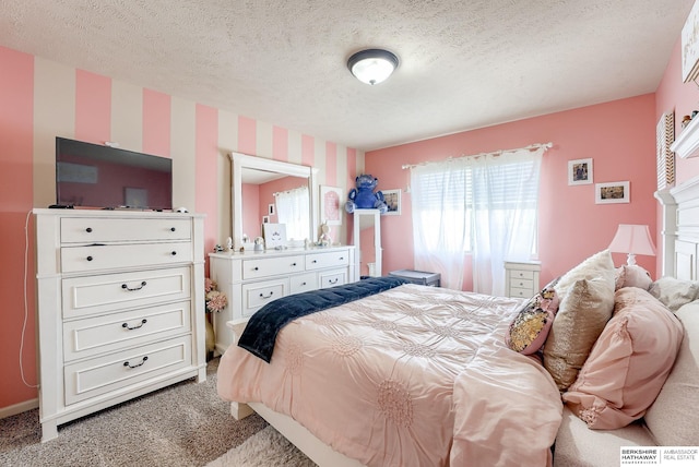 8902 N 161st Ave, Bennington, NE 68007 - bedroom with carpet floors, a textured ceiling, and wallpapered walls