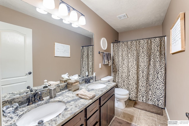 8902 N 161st Ave, Bennington, NE 68007 - full bath with toilet, a textured ceiling, tile patterned flooring, double vanity, and a shower with shower curtain